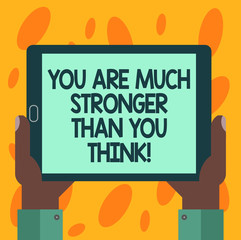 Writing note showing You Are Much Stronger Than You Think. Business photo showcasing Motivation believe in yourself Hu analysis Hand Holding Tablet Smartphone Display Unit photo