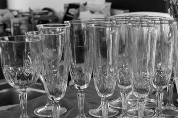 clean transparent glass of wine a lot of glasses festive dishes. Set glass of champagne wine background base