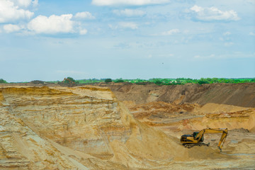 Sand pit. Excavator. Quarry equipment.