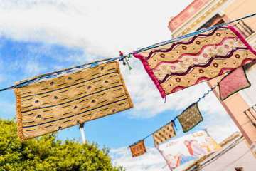 Valencia, Spain - January 27, 2019: Medieval banners hanging between streets at an open-air festival.