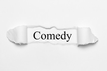 Comedy on white torn paper