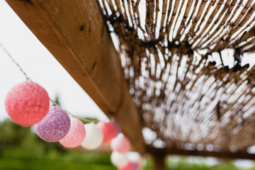 Round garlands of colors hung in country house.