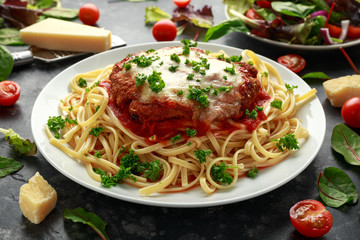 Chicken Parmesan with Cheese and Marinara Sauce served over spaghetti, pasta