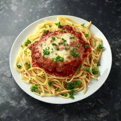 Chicken Parmesan with Cheese and Marinara Sauce served over spaghetti, pasta