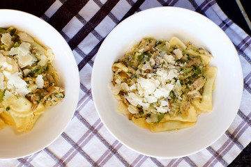 Fresh ricotta and spinach agnolotti with chicken and vegetable sauce.