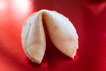 Fortune cookie on red background