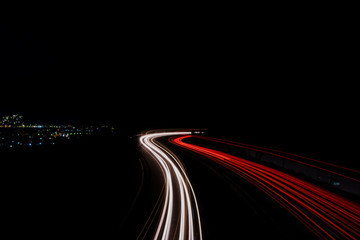 Fototapeta na wymiar Highway at night with car light trails