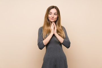Young woman over isolated background scheming something