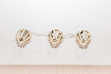 Old fire alarm sensors, smoke detectors installed on the ceiling