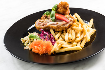 Chicken wraps with fries and salad, restaurant serving portion