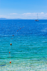 A sea view with a fishing boat hanging around. Skopelos, Greece