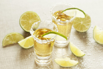 Tequila shots with sliced lime	