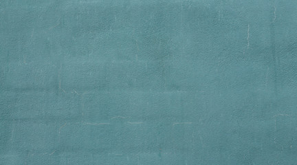 Fototapeta premium Textured blue wall background plastered over bricks