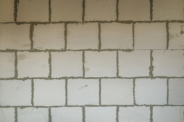 Gas block and concrete wall, finishing the apartment in a building