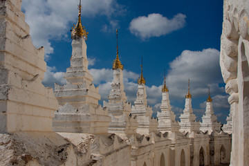 Fototapeta premium Myanmar. Hsin Phyu Shin Pagoda was built in 1816 with special elegance, includes a multi-tiered gallery with small pagoda towers and symbolizes the cosmogonic structure of the universe