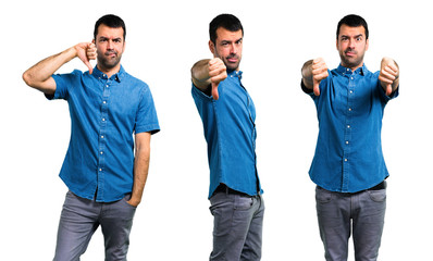 Obraz premium Set of Handsome man with blue shirt showing thumb down sign with negative expression