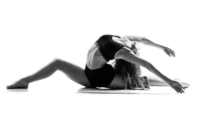 Young dance girl over isolated white background .