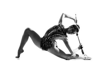 Girl doing rhythmic gymnastics with maces.