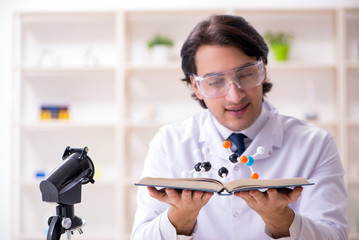 Young male scientist working in the lab 