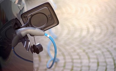 Electric car being charged. Horizontal image with copy space. 
