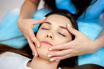 Face massage. Cosmetic procedures for the face. Cosmetology.