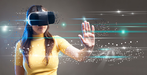 Digital screen with young woman with virtual reality glasses.