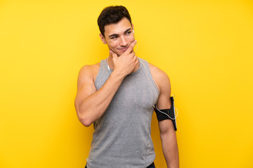 Handsome sport man over isolated background thinking an idea