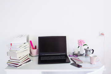 Dorm room, table with stationery and laptop. back to school, ready for studying.