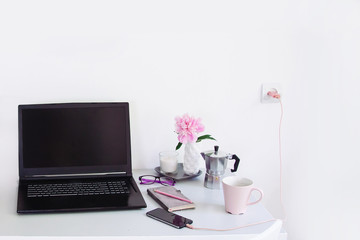 Dorm room, table with stationery and laptop. back to school, ready for studying.