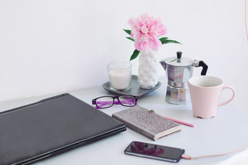Dorm room, table with stationery and laptop. back to school, ready for studying.