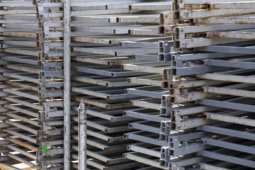 Rows of steel bar storage and stacking in the warehouse for industrial construction.