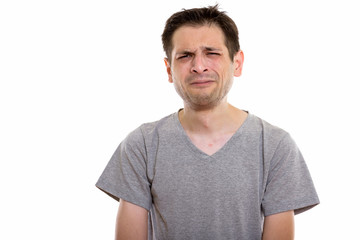 Fototapeta premium Studio shot of young man looking sad