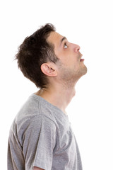 Obraz premium Profile view of young man thinking while looking up 
