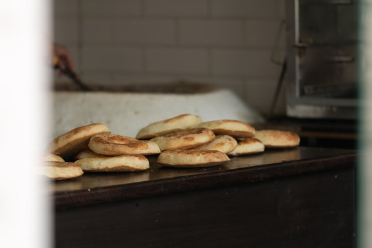 fresh Uzbek bread from the tandoor. National bread.