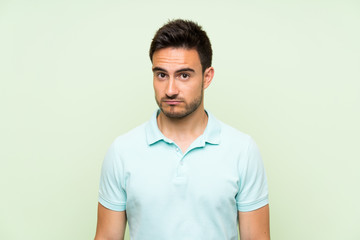 Obraz premium Handsome young man over isolated background with sad and depressed expression