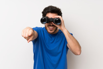 Fototapeta premium Handsome man with black binoculars