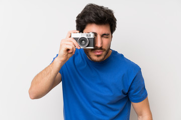 Handsome man holding a camera