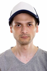 Face of young man wearing cap and looking at camera