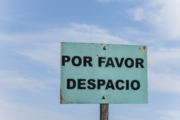 sign saying, Please slow