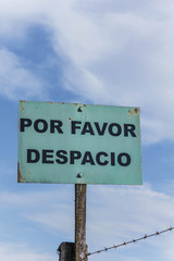 sign saying, Please slow