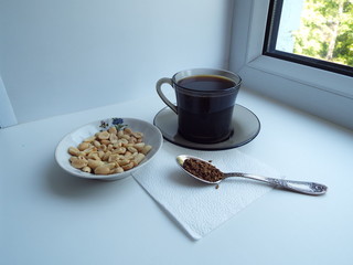 cup of coffee on the windowsill