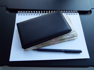 notebook and pen on white background
