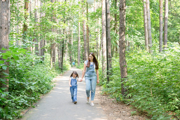 Family and nature concept - Mother and daughter spend time together outdoor