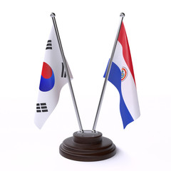 South Korea and Paraguay, two table flags isolated on white background. 3d image