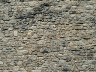 Texture of a stone wall. Old castle stone wall texture background. Stone wall as a background or...
