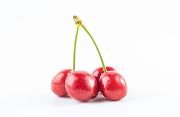 Fresh red cherries on white background