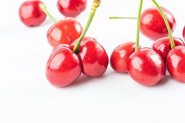 Fresh red cherries on white background