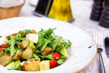 Fresh green salad with pears, feta cheese and avocado