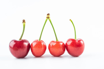Fresh red cherries on white background