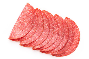 Salami slices on white background.